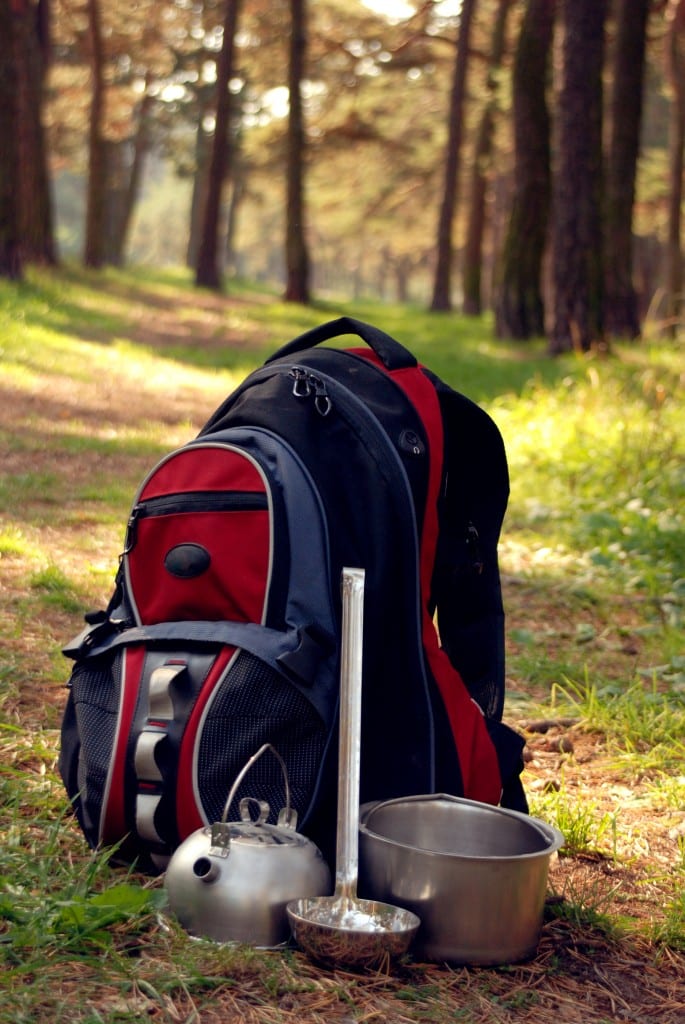 Hiking gear on forest path