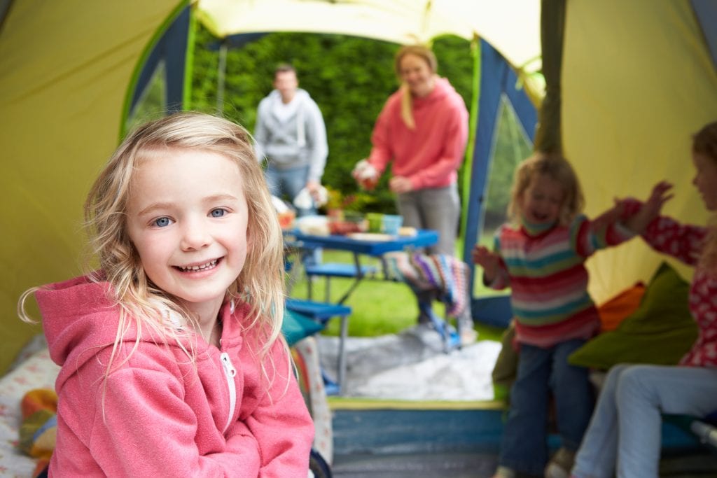 Family Enjoying Camping Holiday On Campsite