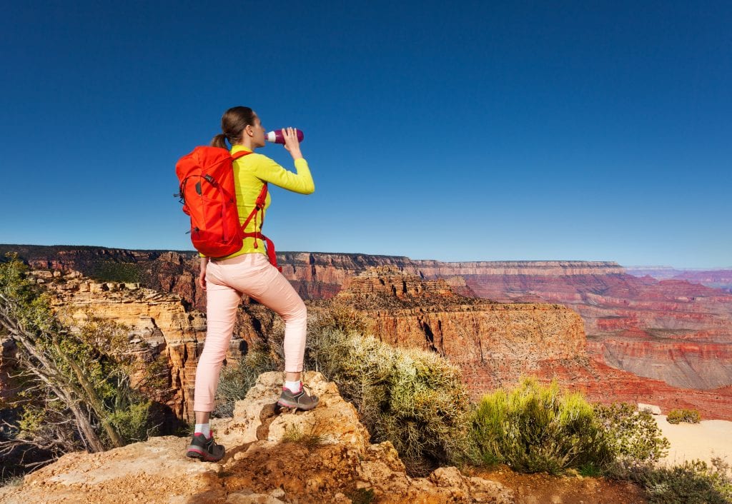 bigstock Hiker drinks water stand on ed 115475750 2