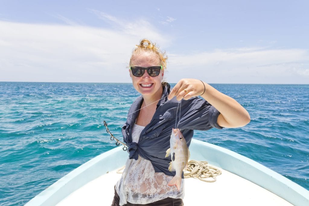 bigstock Woman Holding Up A Fish 93389054