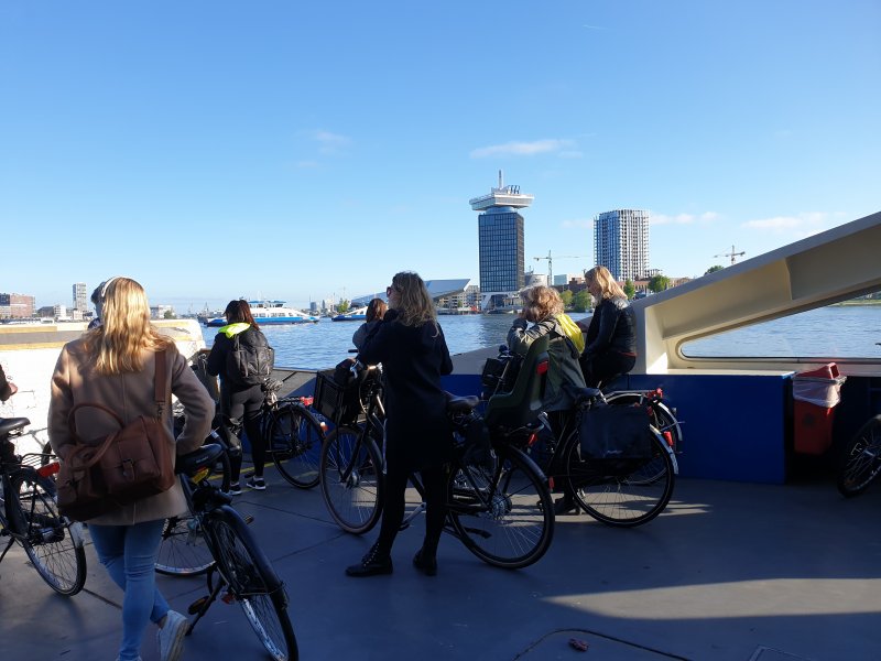 Cyclists on the deck of the ferry commuting to/from work.