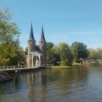 Historic Delft landmarks blend seamlessly with newer construction against the naturally beautiful elements