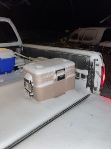 Rugged Road 65 Cooler on back of truck in winter